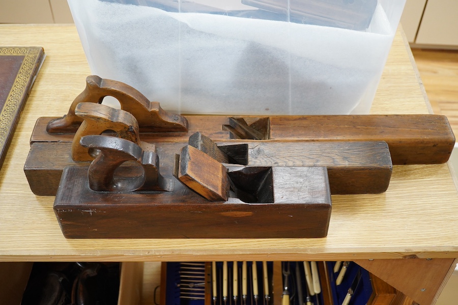 A collection of wooden carpenters tools, including various planes, two saws and a marking gauge, longest plane 73cm long. Condition - some blades missing